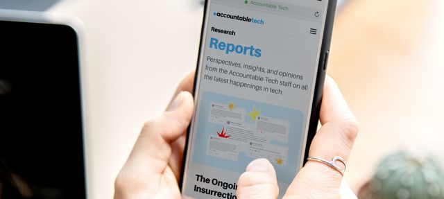 woman-holding-iphone-browsing-accountable-tech-website