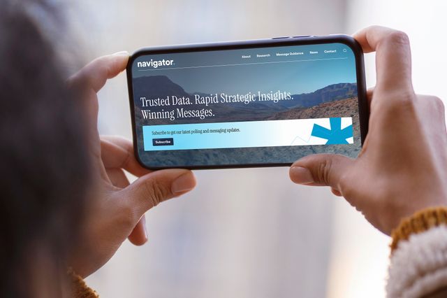 woman-holding-phone-browsing-moms-first-site