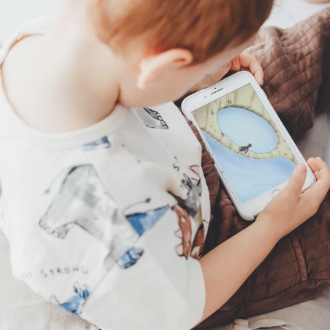 child-holding-iphone-looking-at-image